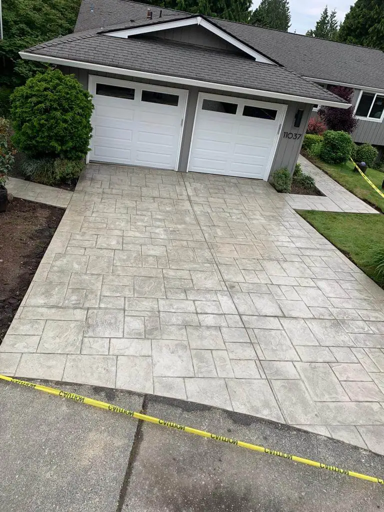 Concrete driveway installation with custom pattern